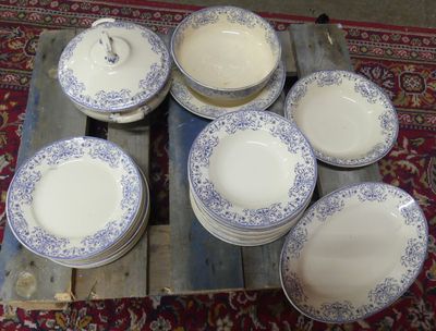 many plates and bowls sitting on a wooden pallet
