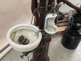 a toilet and a sink in a room that is being worked on