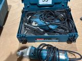 a blue box with tools on a table next to a blue box