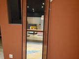 a large mirror in the corner of a room