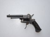 an old gun that is sitting on top of a table