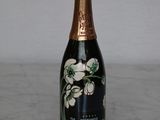 a bottle of wine that is sitting on a table