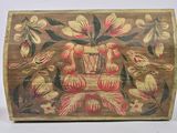 a wooden box with flowers and birds painted on it