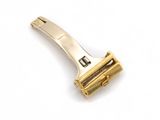 an image of a gold colored razor on a white background