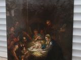 un tableau représentant une crèche avec un bébé dans la crèche