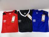 three soccer shirts are sitting on a table with tags on them