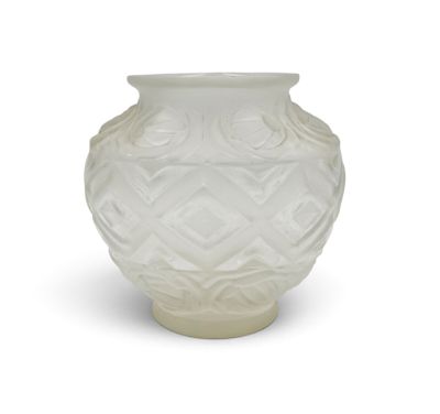 a white vase that is sitting on a white surface