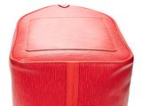 a close up of a red suitcase on a white background