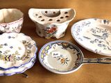 many different types of dishes and cups on the table