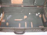 an old suitcase that is open on the floor