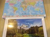 jigsaw puzzle box with a map of the world on top of it