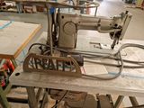 a sewing machine that is sitting on a table