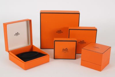 a group of orange boxes with black trims on a white surface
