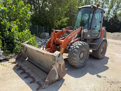 a tractor that is sitting in the dirt