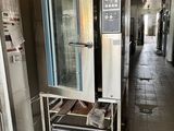a commercial oven that is sitting in the middle of a room