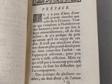 an open book with a picture of a bird on it