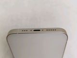 a close up of the back of a silver iphone with a white background