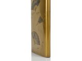an image of a gold lighter with a leaf design on it