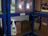 a shelf with several bottles of cleaning products on top of it