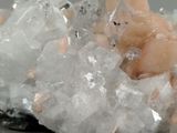 a close up of a cluster of crystals on a piece of rock