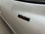 a close up of a car with a sticker on it