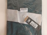 a green shirt with a white stripe on it