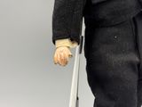 a close up of a toy figure of a man with a cane