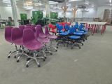 a lot of chairs that are sitting in a room