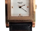 a close up of a watch on a white background