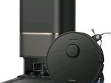 a close up of a black vacuum and a black trash can