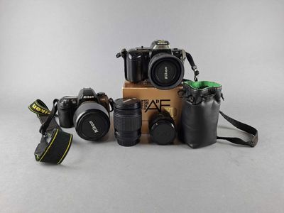 a lot of cameras that are sitting on a table