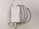 a white charger attached to a white wall