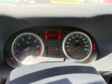 a close up of a car dashboard with a speedometer and gauges