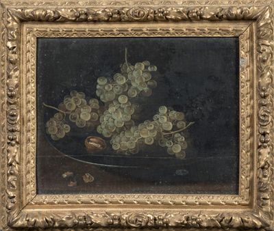 tableau représentant des raisins dans un cadre doré sur fond noir