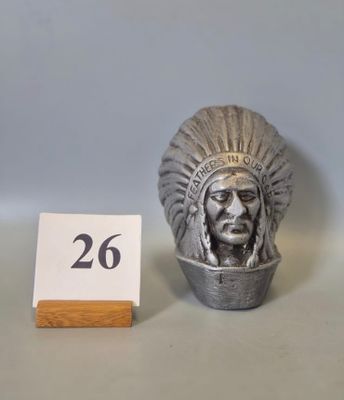 a silver statue of a native american man next to a table number
