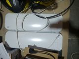 a white computer mouse sitting on top of a cardboard box