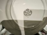 a close up of a plate with a spoon in it