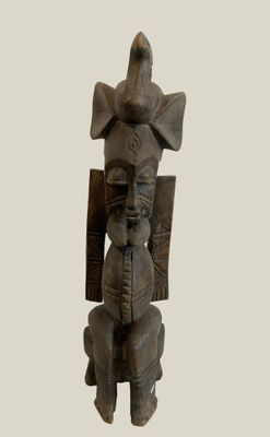 statue of a man with a shield and a shield on his head