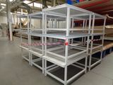 many shelves that are in the middle of a room