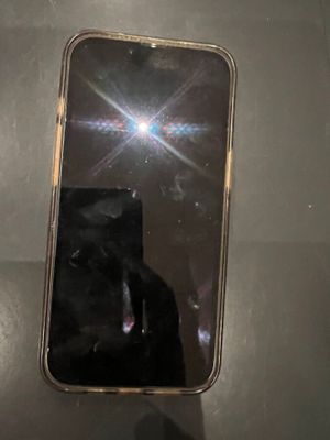 a person taking a picture of a cell phone with a camera