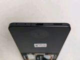 a close up of the back of a black cell phone