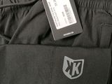 a close up of the back of a pair of black pants with a tag on it