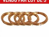 a set of five coils of copper wire on a white background