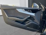 the interior of a car with the door open and the driver ' s side door open
