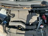 a car engine with the hood up and the hood down