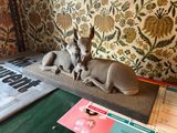 a statue of a deer and a baby deer on a table