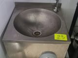 a bathroom with a sink and a mirror in it