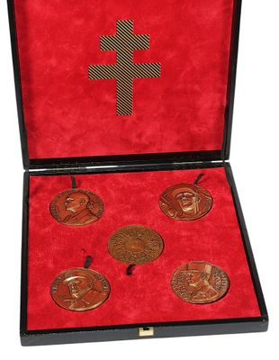 an image of a box with four medals in it on a white background
