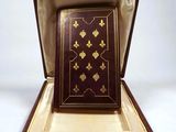 a box with a book inside of it on a white surface