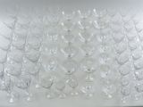a large amount of empty wine glasses on the table